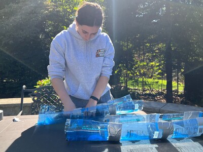 Making a splash: She turns plastic bottles into rainwater collectors