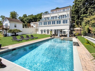 See it: Stunning $5 million waterfront mansion with dock, beach, pool